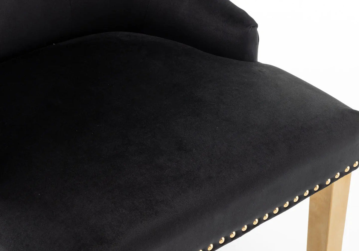 2 chaises capitonnées noir tête de lion | Kreo