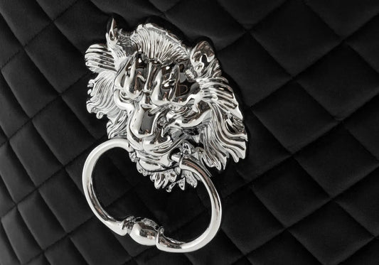 Chaise capitonnée noir tête de lion | Kreo