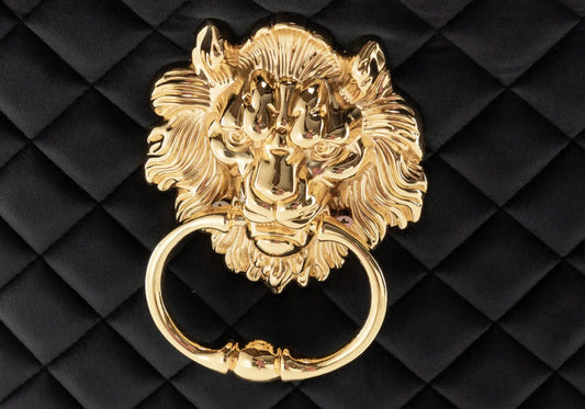 2 chaises capitonnées noir tête de lion | Kreo