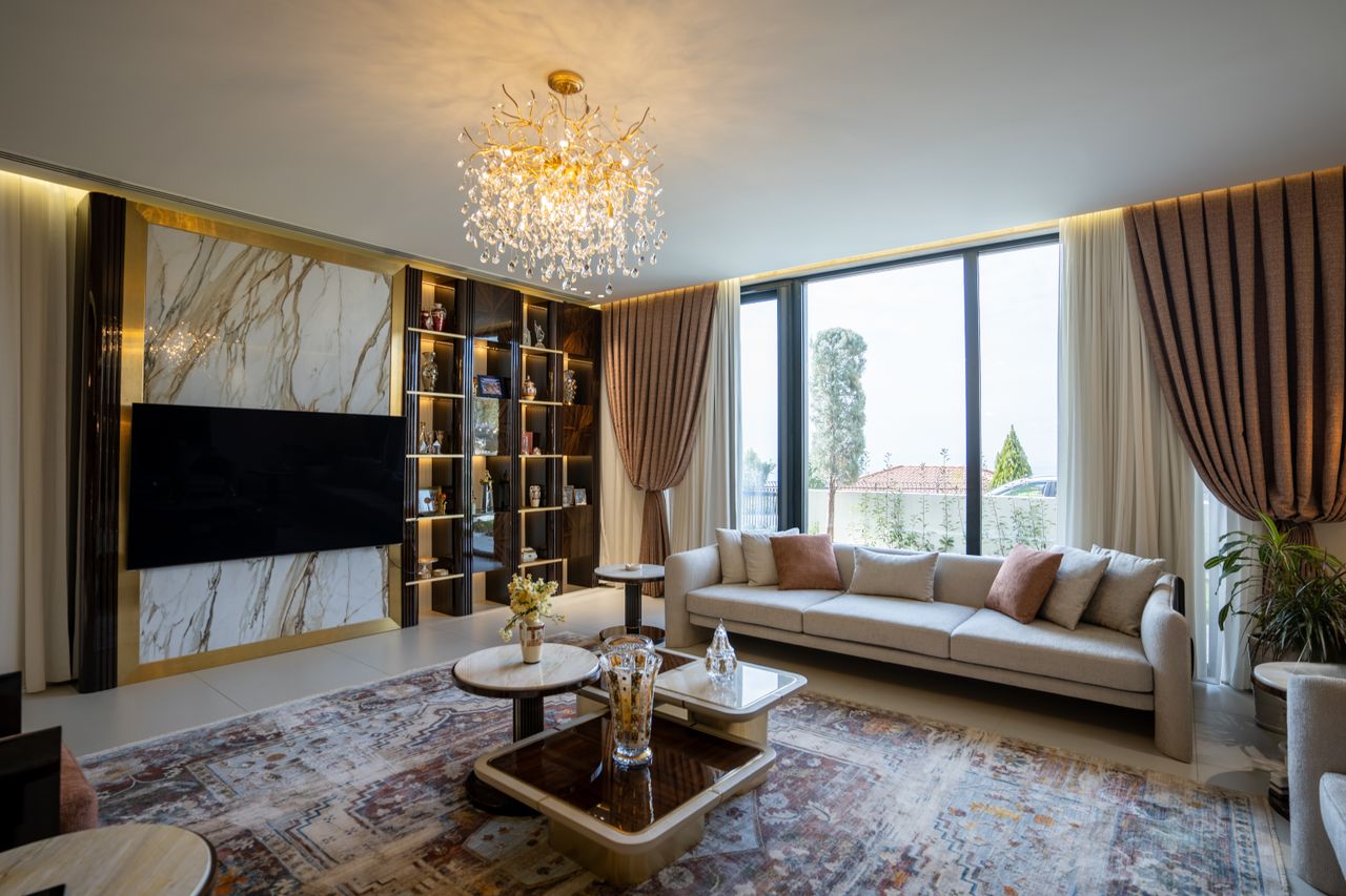 Luxurious modern living room with chandelier and large windows in Sulaymaniyah, Kurdistan.