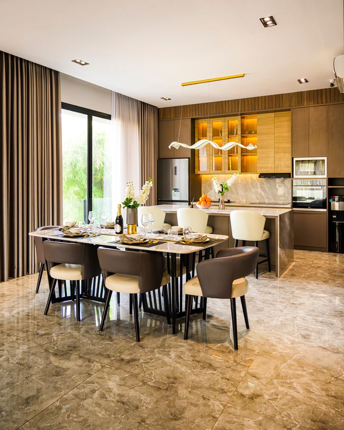 Luxurious dining room in Jakarta with a set dining table and elegant interior design.